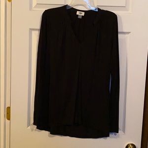 Black v-neck blouse.